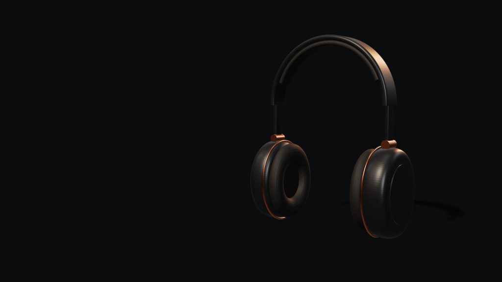 Norn One wireless headphones in graphite with copper details.